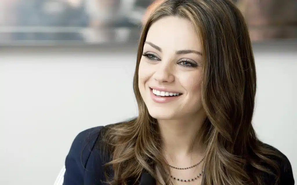 A smiling Mila Kunis looking healthy and vibrant
