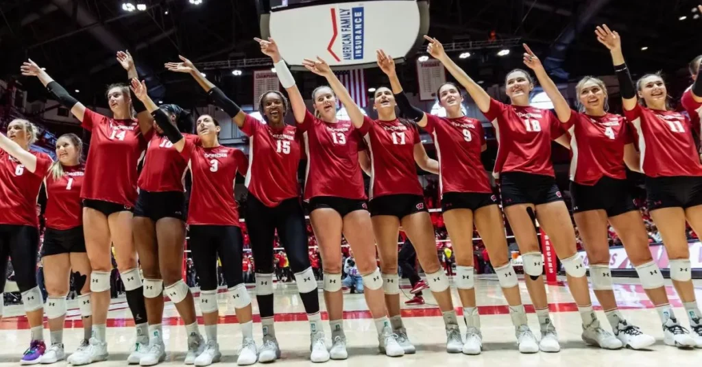 University of Wisconsin womens volleyball team celebrating victory in the locker room